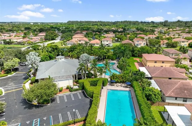 an aerial view of a house with a garden