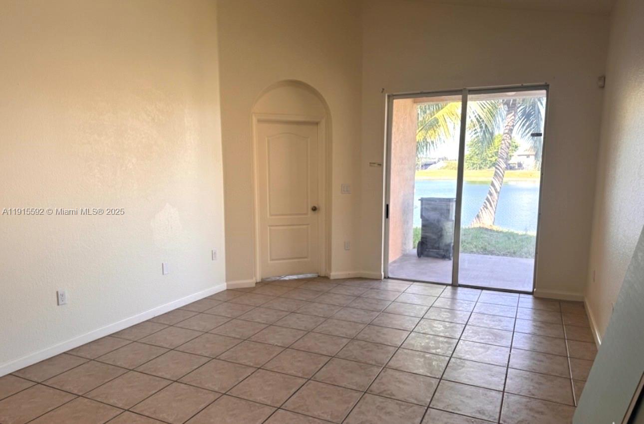 3725 Northeast 23rd Court Homestead, FL 33033 - Photo 6 of 25 a view of an empty room and window