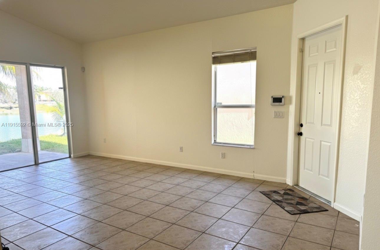 3725 Northeast 23rd Court Homestead, FL 33033 - Photo 7 of 25 a view of an empty room and window