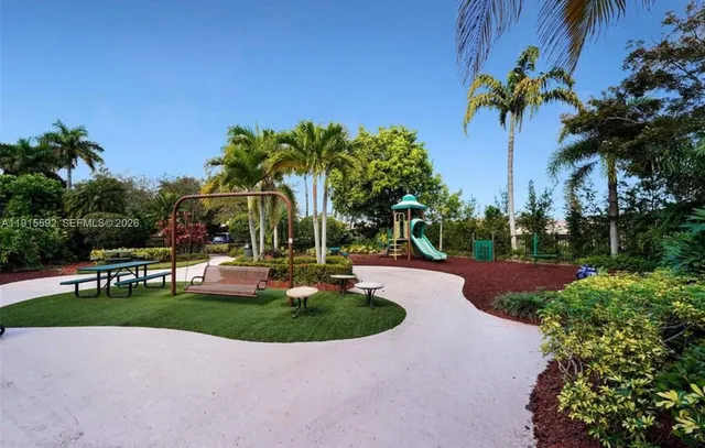 a view of a swimming pool with a table and chairs