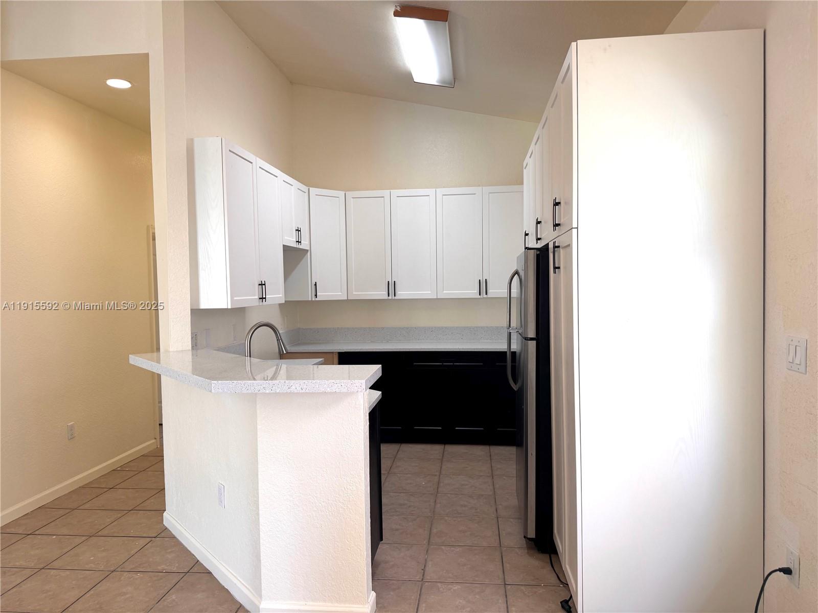 3725 Northeast 23rd Court Homestead, FL 33033 - Photo 9 of 25 a kitchen with a sink cabinets and utility