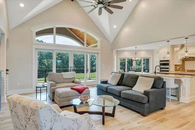 a kitchen with stainless steel appliances granite countertop a stove and a wooden floors