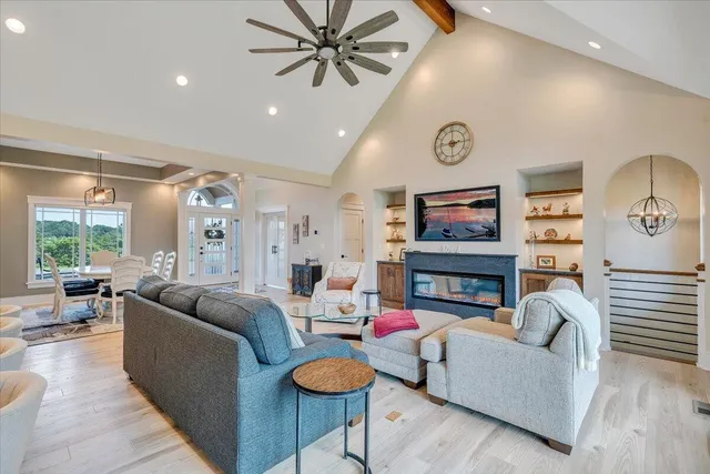 a kitchen with stainless steel appliances kitchen island granite countertop a stove and a sink