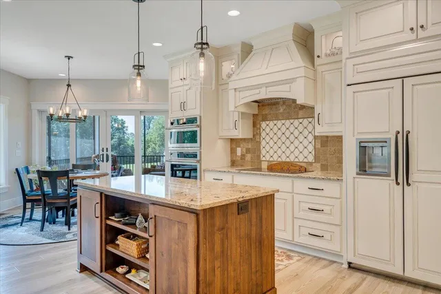 a spacious bedroom with a large bed and a large window