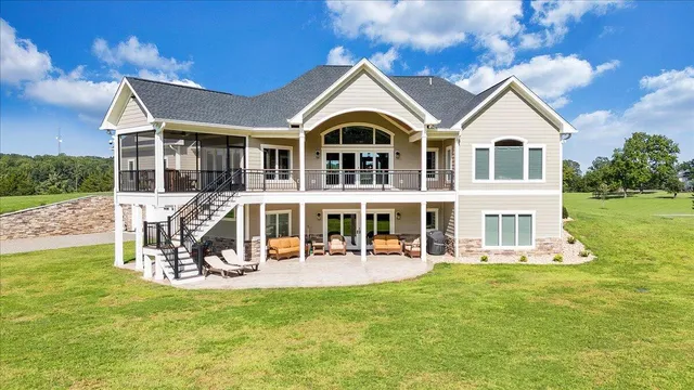 a view of a house with swimming pool and porch