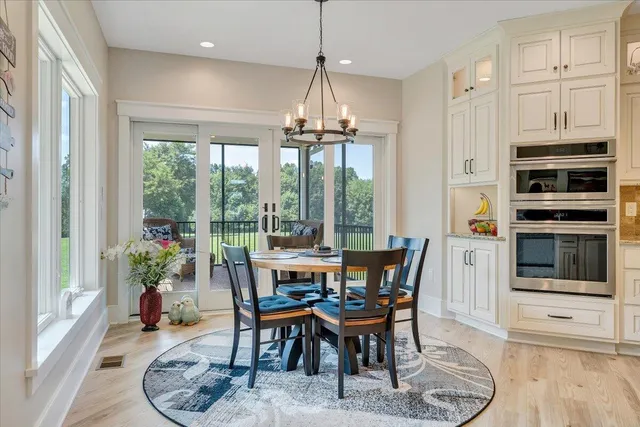 a living room with stainless steel appliances kitchen island granite countertop furniture and a view of kitchen