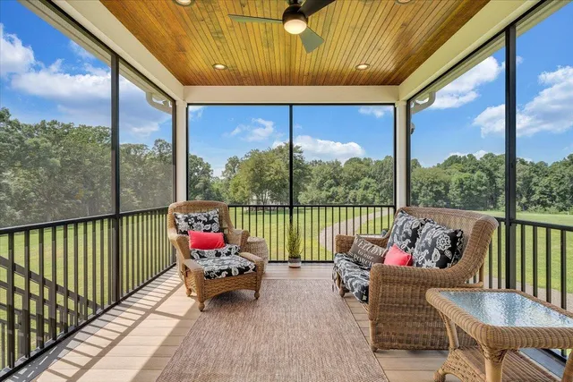 a bed room with a bed and a large window