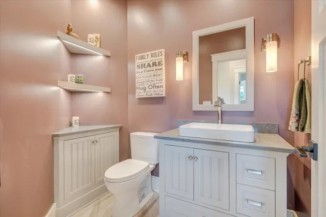 a living room with furniture a rug and a large window