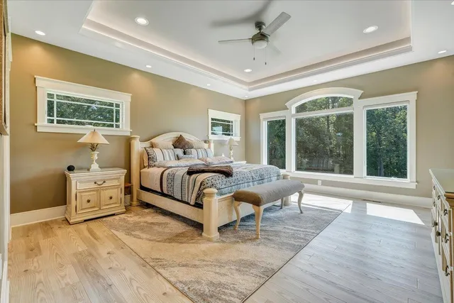 a spacious bedroom with a bed and a couch
