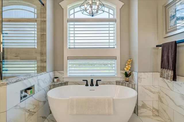 a view of a house with a big yard and swimming pool