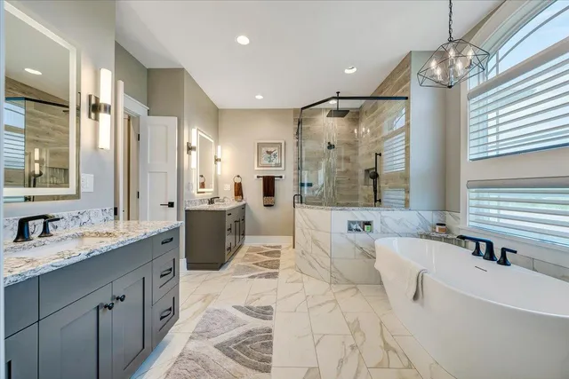 a view of a swimming pool with a yard and wooden fence