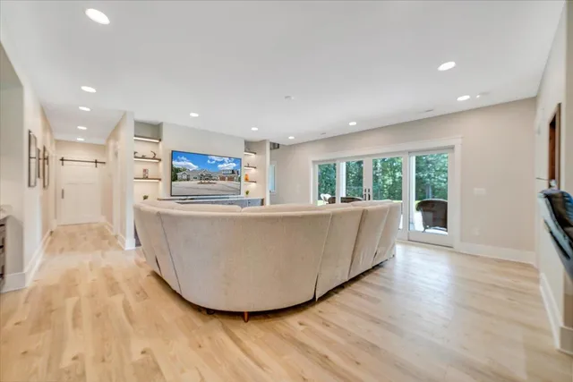 an aerial view of a house with a yard basket ball court and outdoor seating