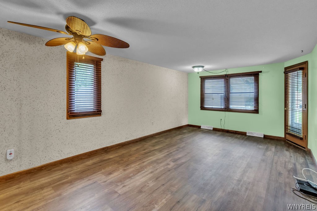 4755 Chestnut Ridge Road, Unit 9 Amherst, NY 14228 - Photo 25 of 46 Living room area with door to rear deck