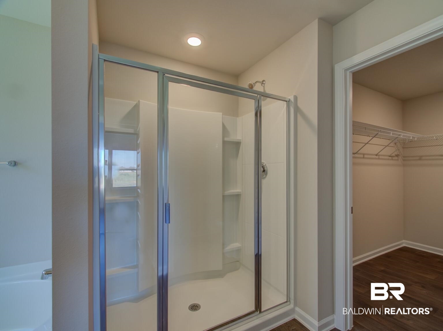 23952 Citation Loop Daphne, AL 36526 - Photo 24 of 69 Full bath with a spacious closet, a shower stall, dark wood-style flooring, and a bath
