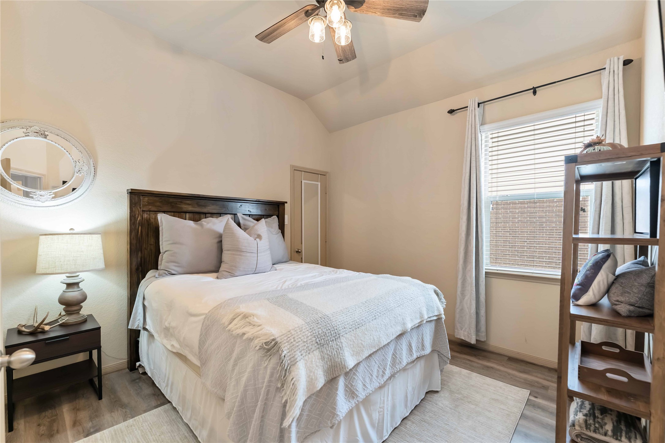 2502 Tiger Eye Drive Rosharon, TX 77583 - Photo 7 of 29 This cozy bedroom features a warm, inviting atmosphere with a ceiling fan, ample natural light from a window.