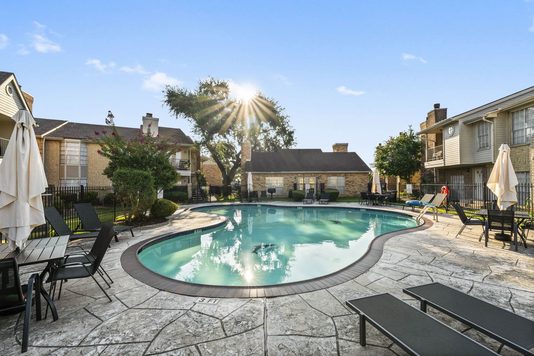 a view of a swimming pool with a patio