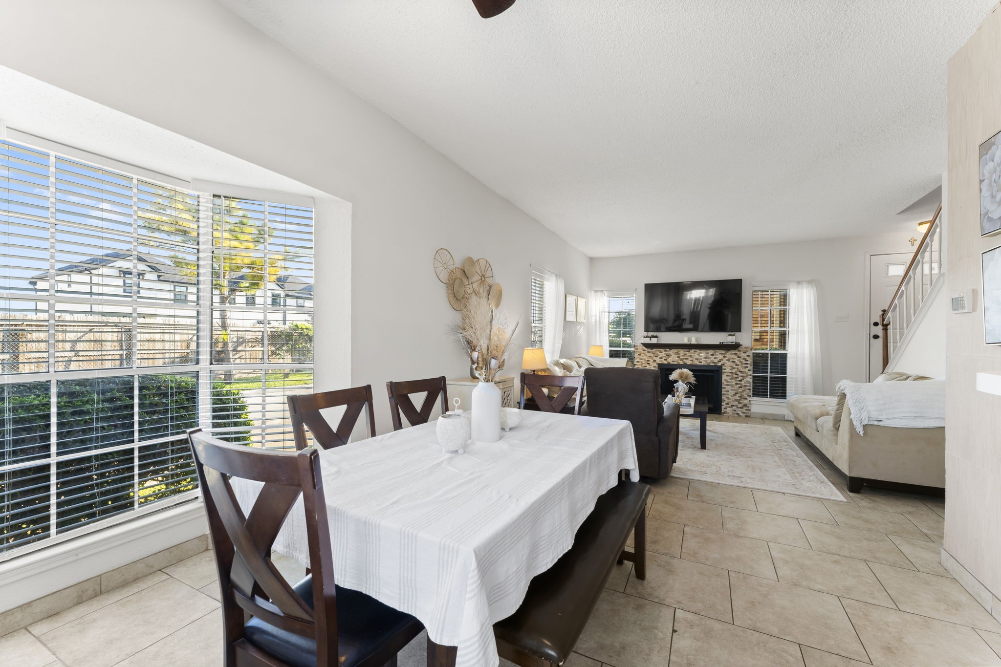 3600 Jeanetta Street, Unit 605 Houston, TX 77063 - Photo 15 of 29 a view of a dining room with furniture window and a fireplace