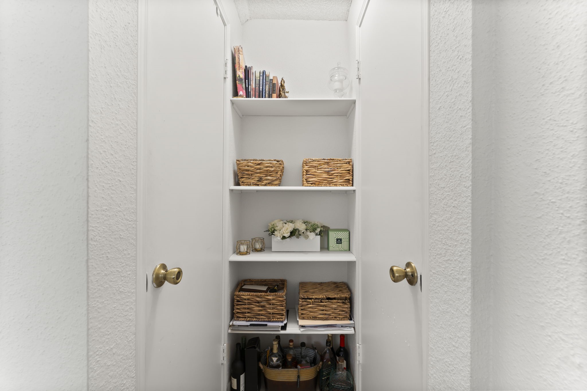 3600 Jeanetta Street, Unit 605 Houston, TX 77063 - Photo 18 of 29 a table with a painting on the wall and a wooden floor