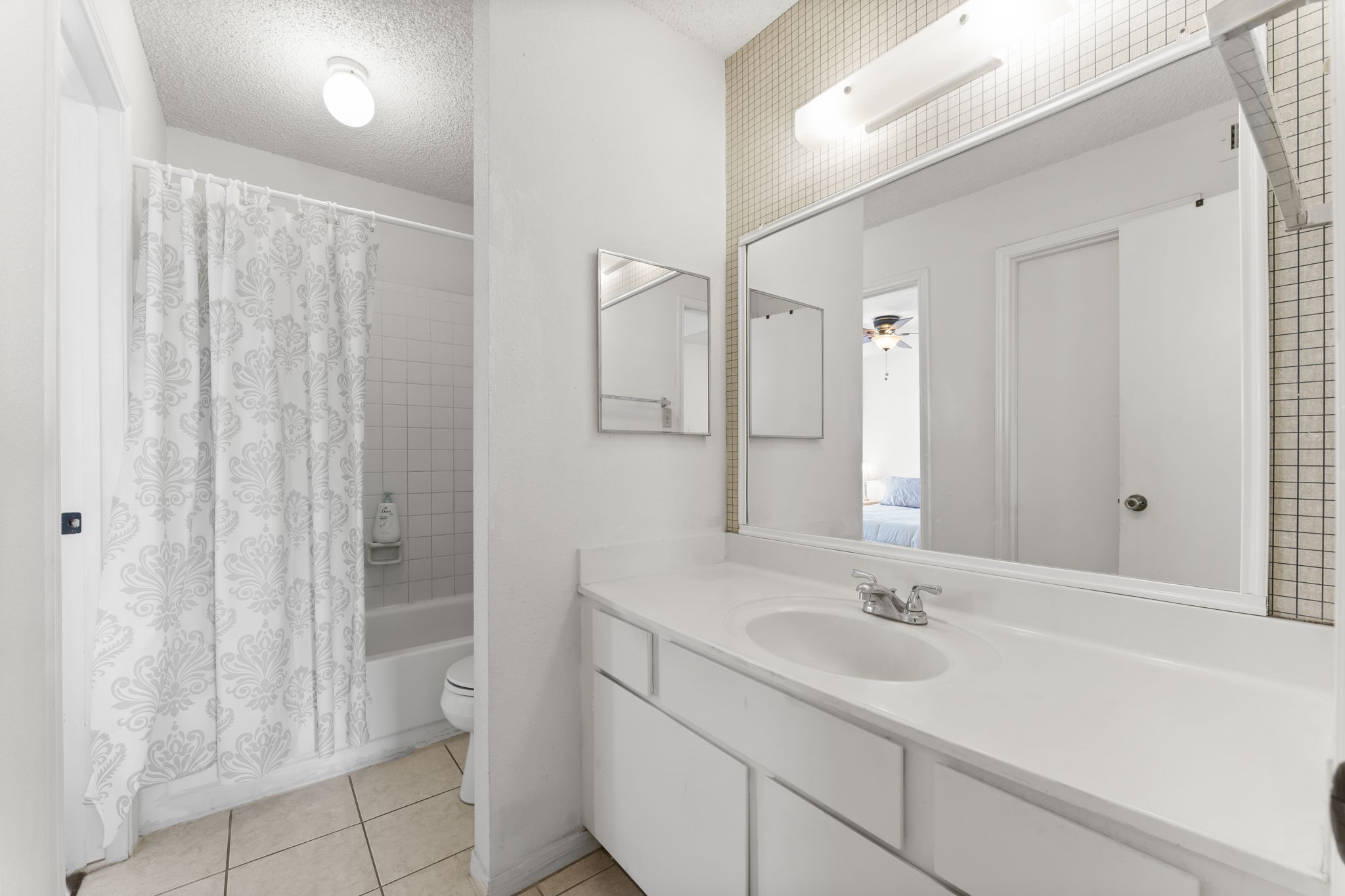 3600 Jeanetta Street, Unit 605 Houston, TX 77063 - Photo 23 of 29 a bathroom with a sink and a mirror