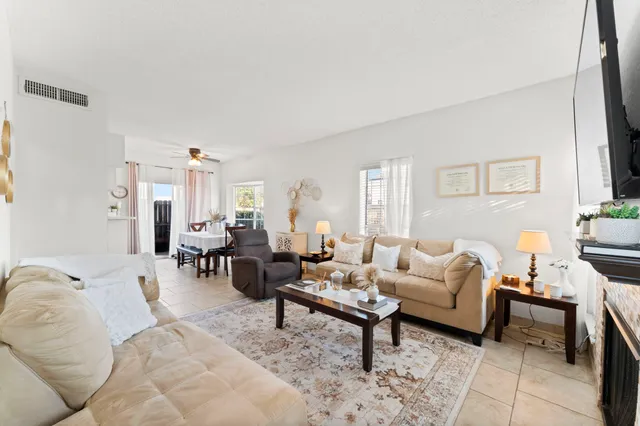 a living room with furniture and a rug