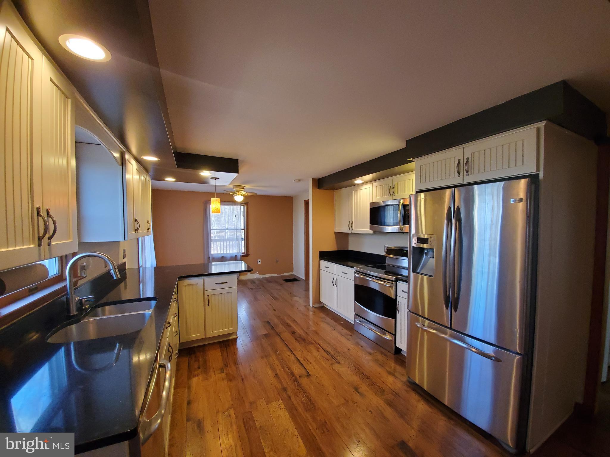 4742 Coxey Brown Road Frederick, MD 21702 - Photo 3 of 33 Beautifully updated kitchen with quartz counters.