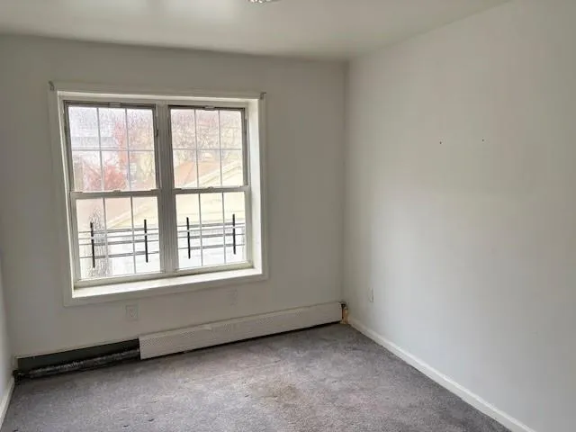 a kitchen with a refrigerator sink and cabinets