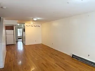 a view of a livingroom with wooden floor