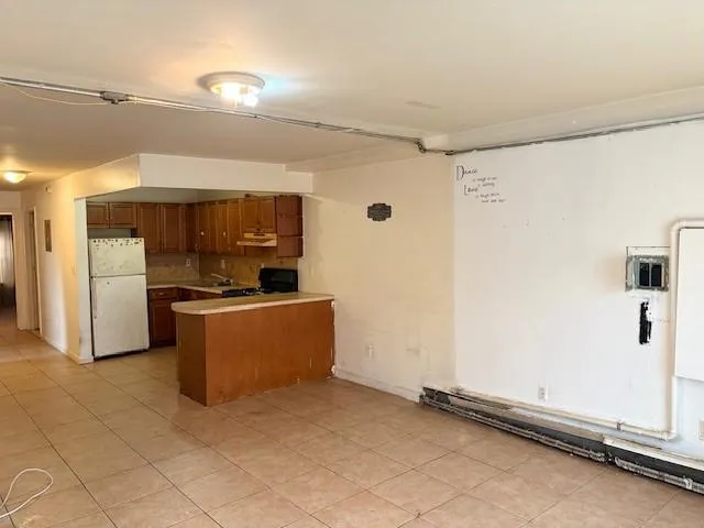 a view of kitchen with furniture and a window