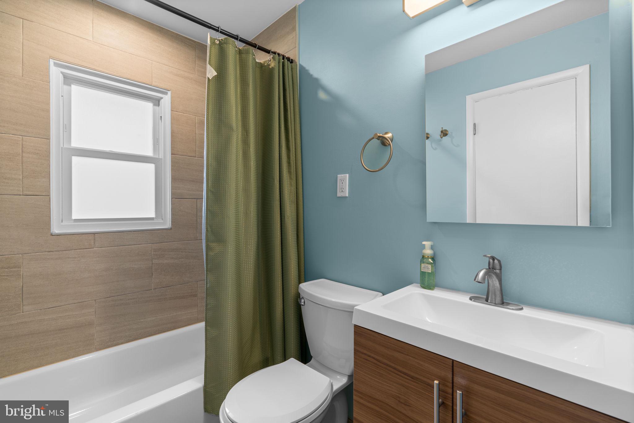 226 Maryland Way Edgewater, MD 21037 - Photo 13 of 30 a bathroom with a sink toilet and shower