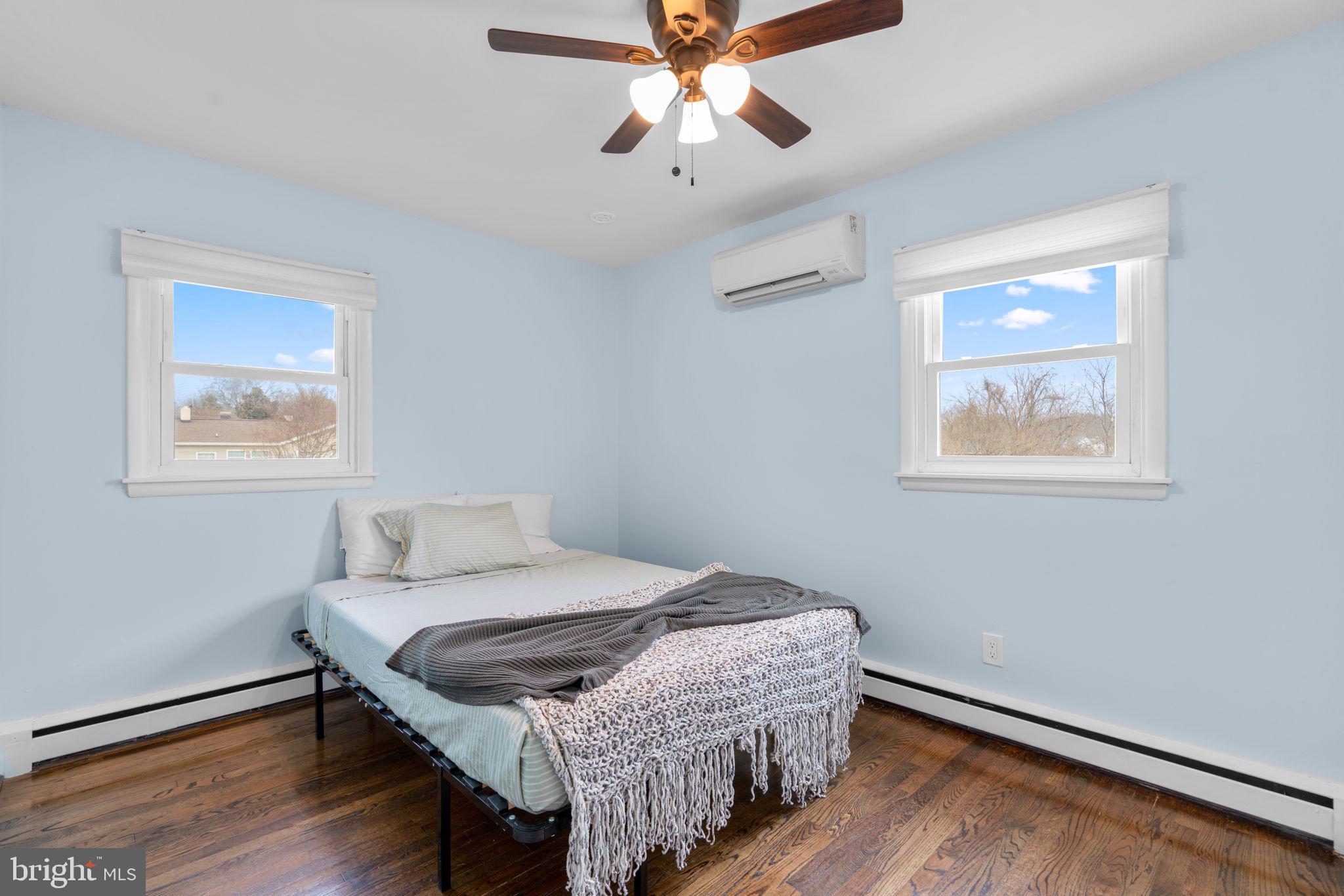 226 Maryland Way Edgewater, MD 21037 - Photo 14 of 30 a bedroom with a bed and a chandelier
