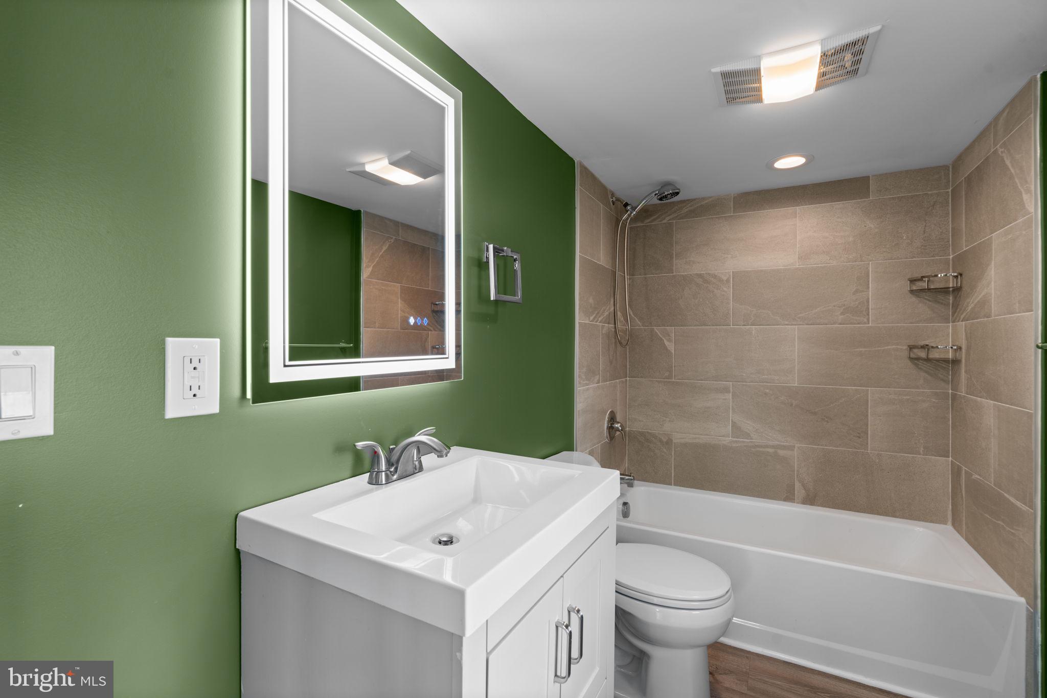 226 Maryland Way Edgewater, MD 21037 - Photo 15 of 30 a bathroom with a sink toilet and shower