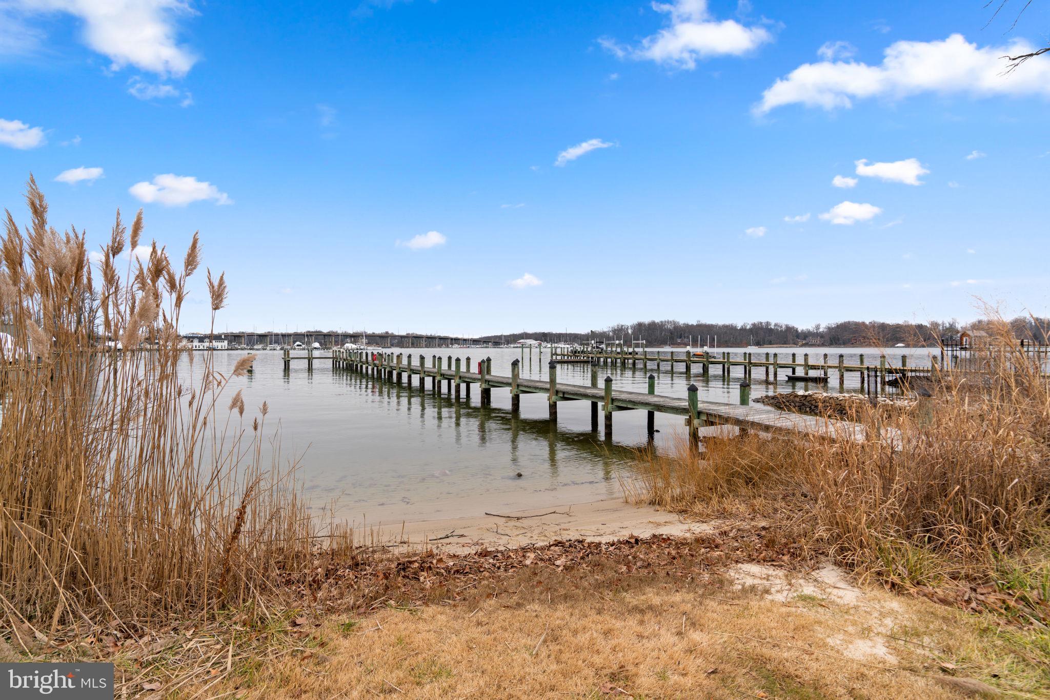 226 Maryland Way Edgewater, MD 21037 - Photo 23 of 30 a view of a lake with table and chairs