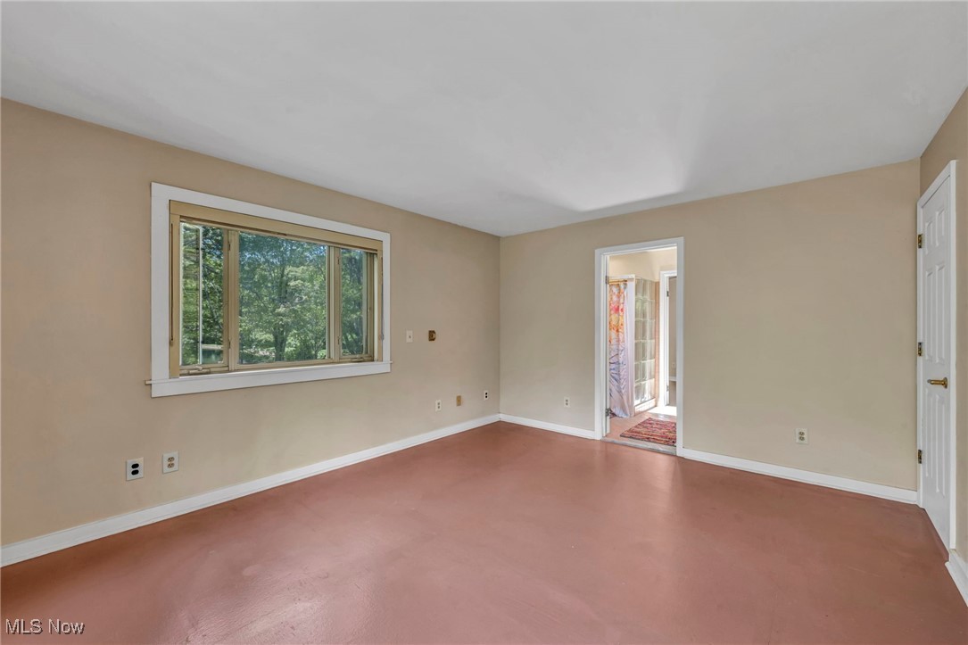 10982 Root Road Columbia Station, OH 44028 - Photo 21 of 49 Unfurnished room featuring finished concrete flooring and baseboards