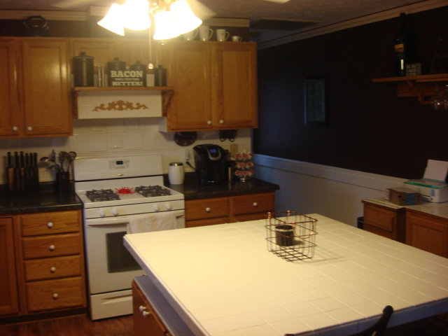 2387 North 24th Road Marseilles, IL 61341 - Photo 8 of 23 a kitchen with a stove a sink and a refrigerator