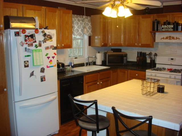 2387 North 24th Road Marseilles, IL 61341 - Photo 9 of 23 a kitchen with stainless steel appliances a refrigerator and a stove top oven