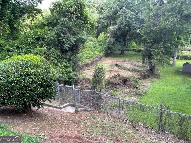 a backyard of a house with lots of green space