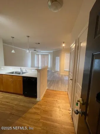 a kitchen with a refrigerator and a sink