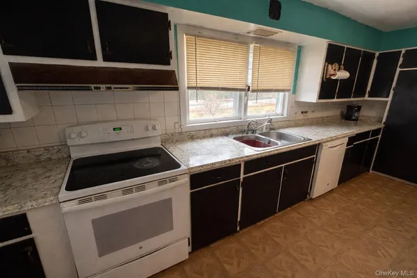 a kitchen that has a sink and a stove
