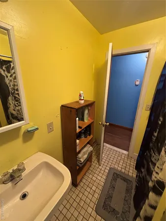 a bathroom with a sink and mirror