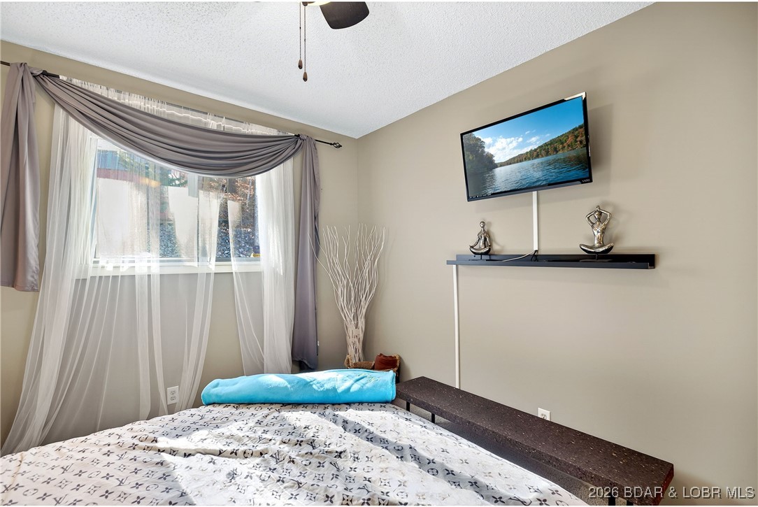 79 Honeysuckle Road, Unit 79 Lake Ozark, MO 65049 - Photo 11 of 54 Main level bedroom 2