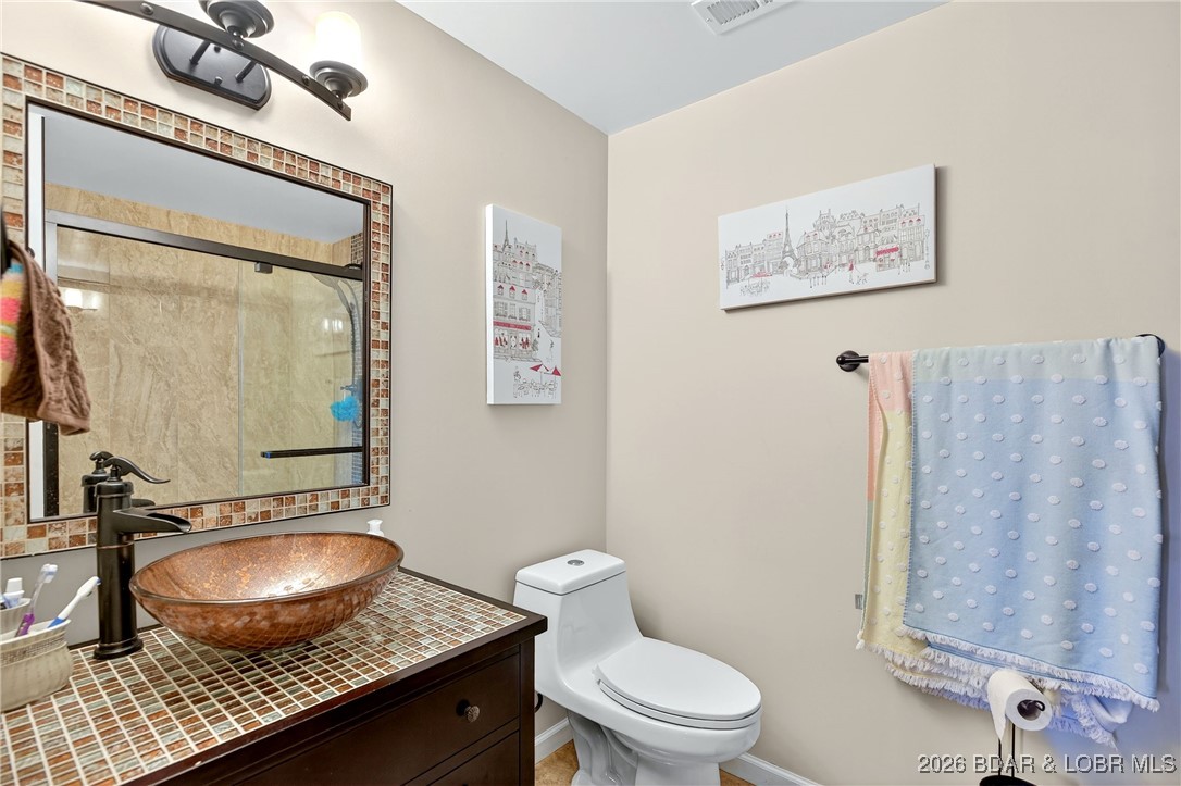79 Honeysuckle Road, Unit 79 Lake Ozark, MO 65049 - Photo 22 of 54 Lower level bathroom