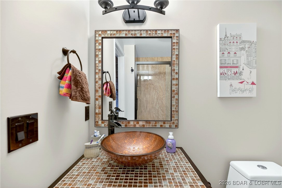 79 Honeysuckle Road, Unit 79 Lake Ozark, MO 65049 - Photo 25 of 54 lower level bathroom