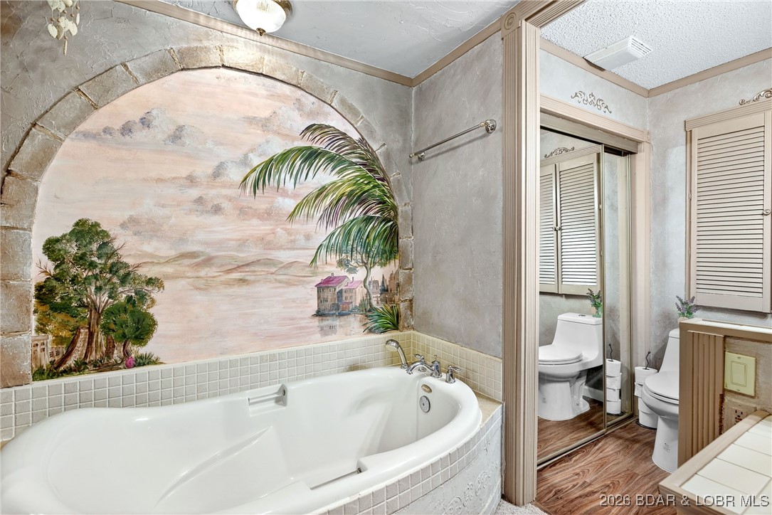 79 Honeysuckle Road, Unit 79 Lake Ozark, MO 65049 - Photo 6 of 54 Main level bathroom