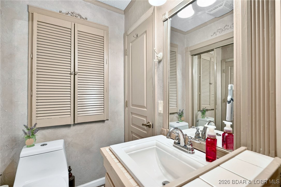 79 Honeysuckle Road, Unit 79 Lake Ozark, MO 65049 - Photo 8 of 54 Main level bathroom