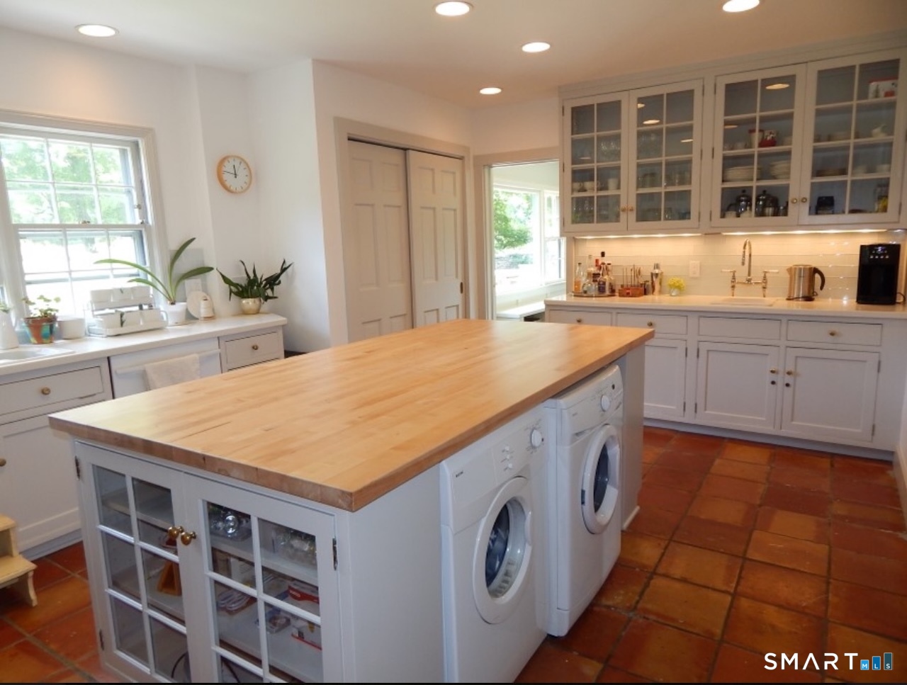 87 Beaver Dam Road Salisbury, CT 06068 - Photo 10 of 35 a kitchen with a stove a sink a window and cabinets