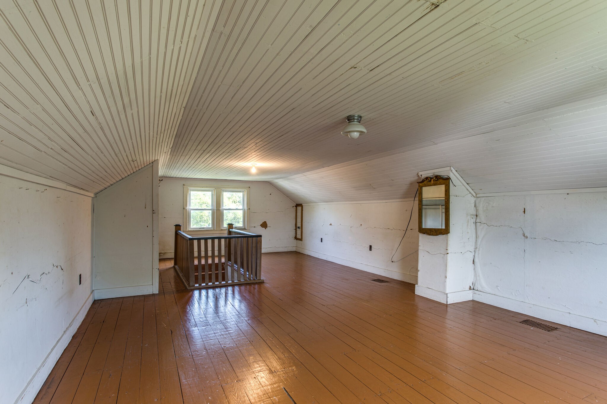 9188 Versailles Road Rockvale, TN 37153 - Photo 20 of 25 an empty room with wooden floor and windows