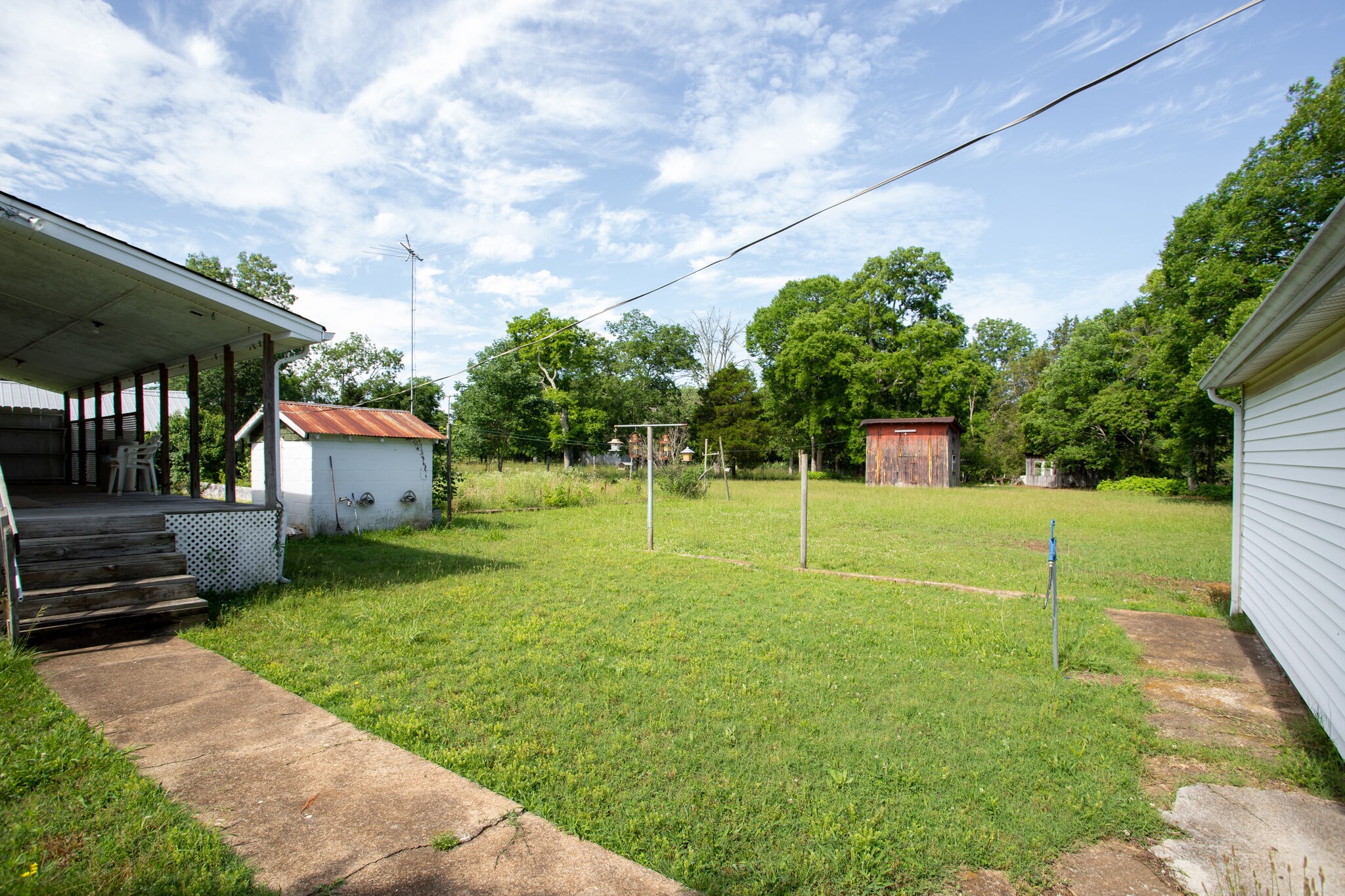 9188 Versailles Road Rockvale, TN 37153 - Photo 23 of 25 a view of a house with backyard