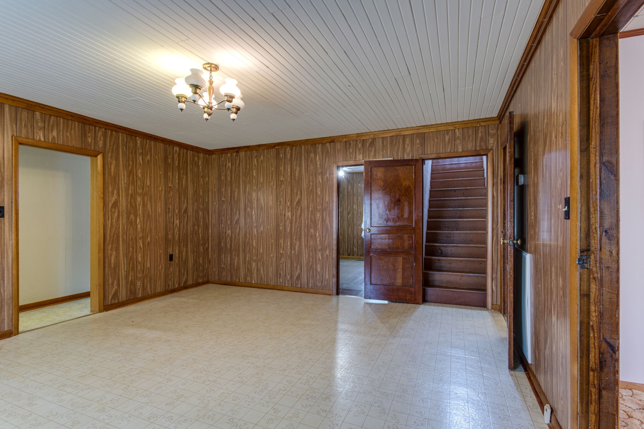 9188 Versailles Road Rockvale, TN 37153 - Photo 8 of 25 an empty room with wooden floor chandelier and closet area