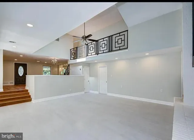 a view of a hallway with stairs