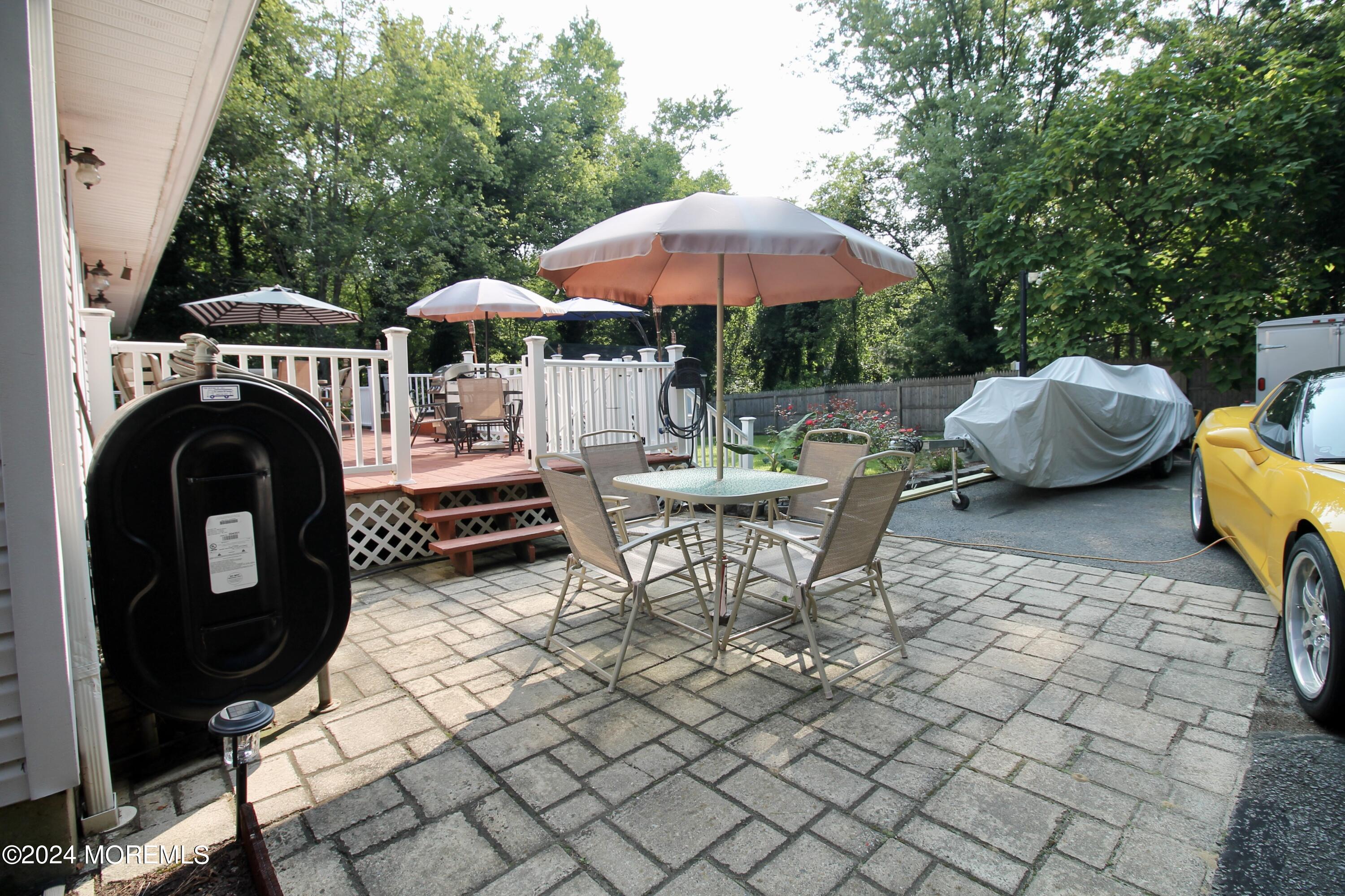877 Monmouth Road Cream Ridge, NJ 08514 - Photo 46 of 58 a swimming pool with outdoor seating